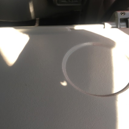 eclipse projected onto airplane seat tray